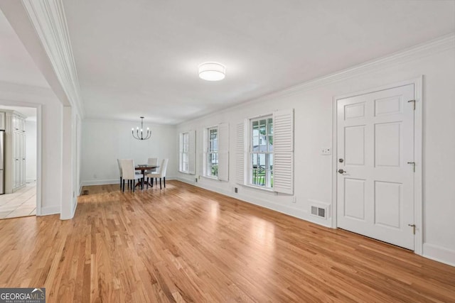 1501 Memory Ln SE, Smyrna, GA 30080 - foyer entrance with crown molding, light wood-style flooring, and a chandelier