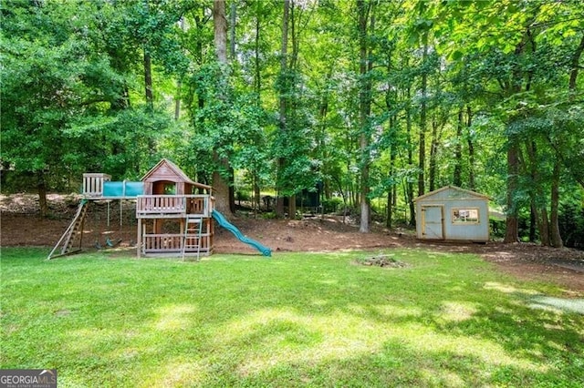 9685 Cone Ct, Roswell, GA 30075 - view of grassy yard with a storage unit and a playground