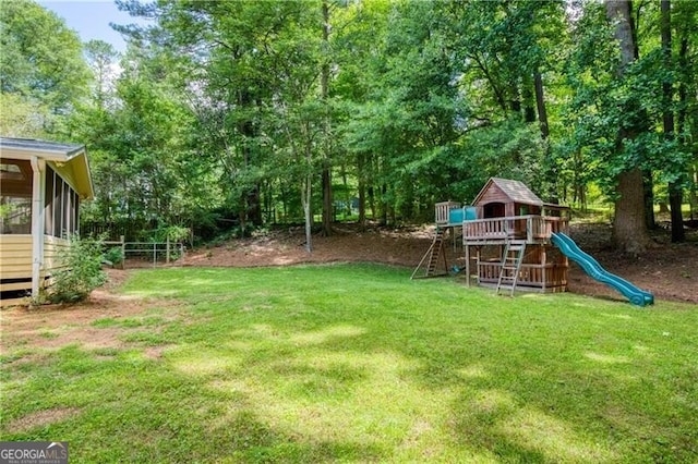 9685 Cone Ct, Roswell, GA 30075 - view of green lawn featuring a playground, view of scattered trees, and a sunroom