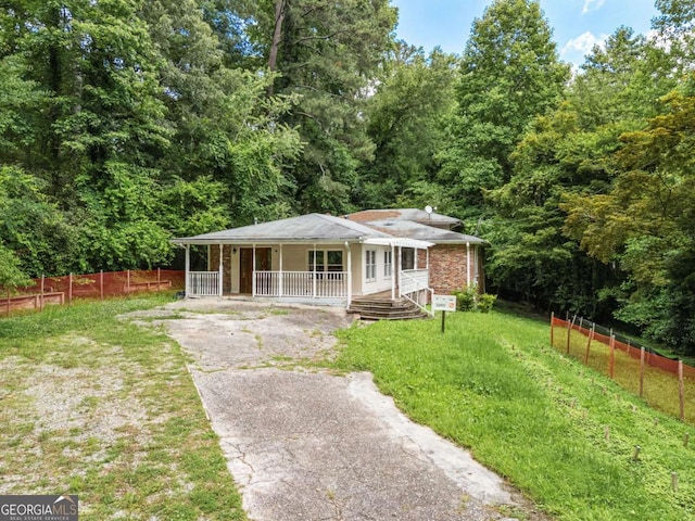 265 Mayfield Rd, Alpharetta, GA 30009 - bungalow-style home with covered porch, asphalt driveway, and a view of trees