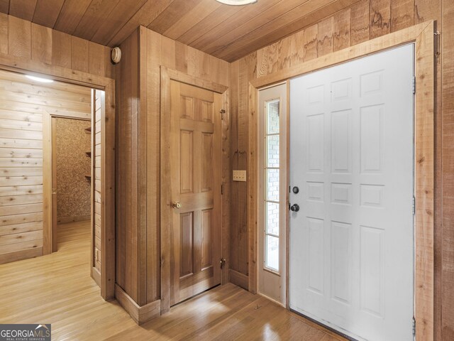210 Roberts Point Rd, Jackson, GA 30233 - foyer with wood walls, light wood-style flooring, and wood ceiling