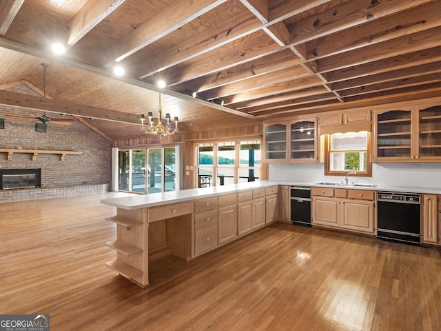 210 Roberts Point Rd, Jackson, GA 30233 - kitchen featuring black dishwasher, brick wall, open floor plan, light wood finished floors, and light countertops