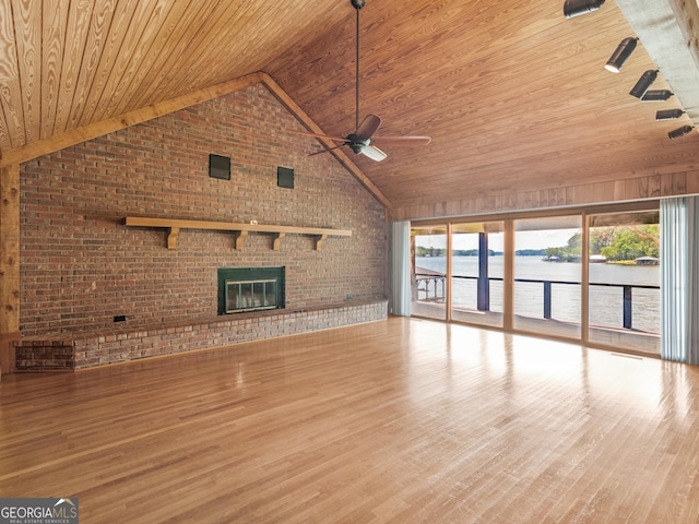 210 Roberts Point Rd, Jackson, GA 30233 - unfurnished living room with wooden ceiling, brick wall, ceiling fan, a water view, and a brick fireplace