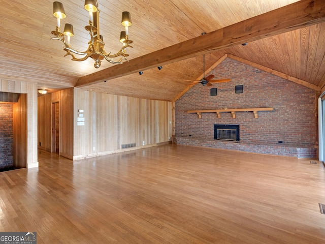 210 Roberts Point Rd, Jackson, GA 30233 - unfurnished living room with a chandelier, wood finished floors, wooden ceiling, brick wall, and a fireplace