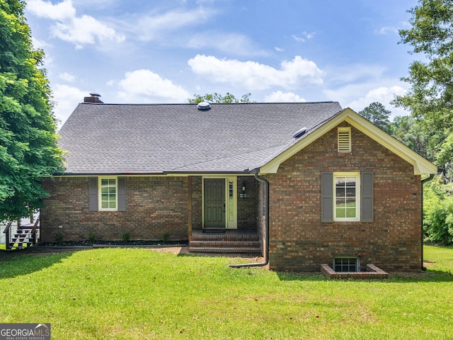 210 Roberts Point Rd, Jackson, GA 30233 - view of front of home featuring a front lawn, brick siding, a shingled roof, and a chimney