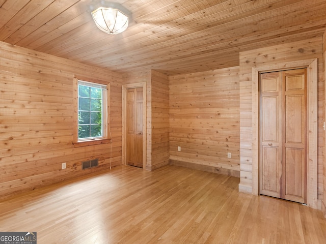 210 Roberts Point Rd, Jackson, GA 30233 - unfurnished bedroom with light wood-style flooring, wood walls, and wood ceiling