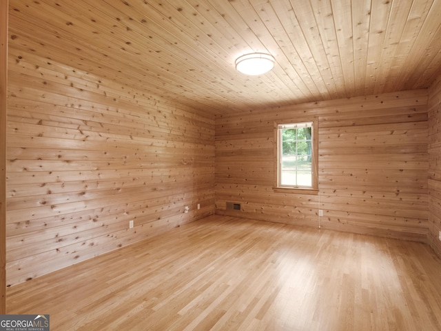 210 Roberts Point Rd, Jackson, GA 30233 - spare room featuring wooden ceiling, wood walls, and light wood-style floors