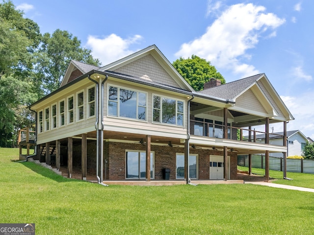 210 Roberts Point Rd, Jackson, GA 30233 - back of property with ceiling fan, a garage, a shingled roof, a chimney, and a patio
