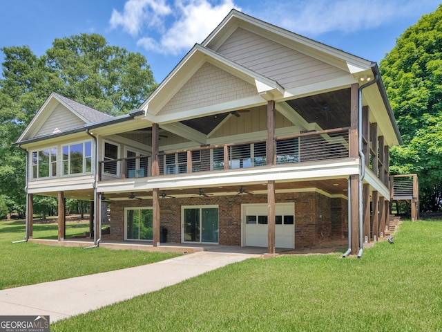 210 Roberts Point Rd, Jackson, GA 30233 - back of property featuring a ceiling fan, a garage, and a yard