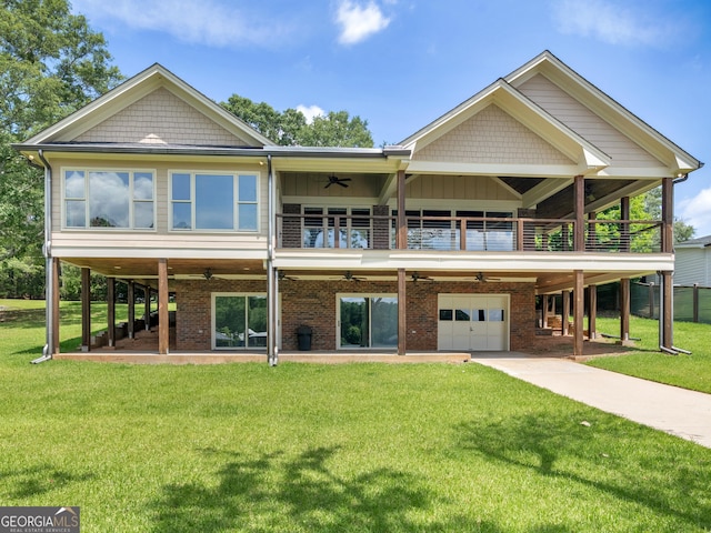 210 Roberts Point Rd, Jackson, GA 30233 - view of front of home featuring a ceiling fan, a front yard, a balcony, an attached garage, and concrete driveway