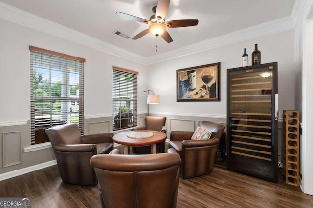 7430 Ramsgate Ct, Cumming, GA 30040 - sitting room with beverage cooler, a ceiling fan, ornamental molding, wood finished floors, and wainscoting