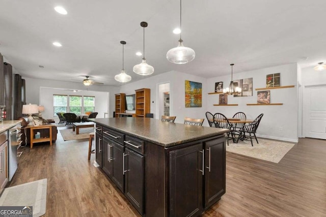 7430 Ramsgate Ct, Cumming, GA 30040 - kitchen with dark wood-style flooring, recessed lighting, ceiling fan, open floor plan, and stainless steel dishwasher