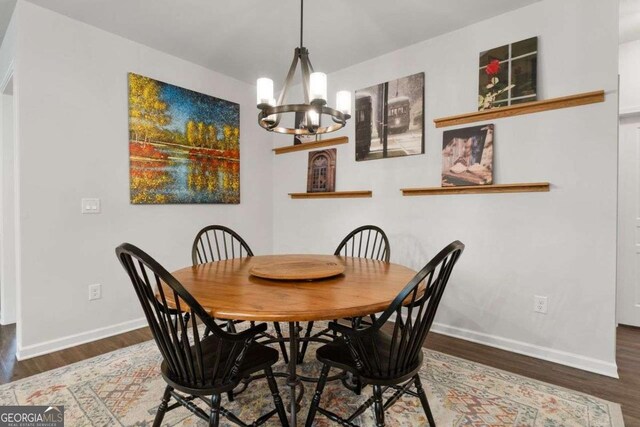 7430 Ramsgate Ct, Cumming, GA 30040 - dining area with a chandelier and wood finished floors