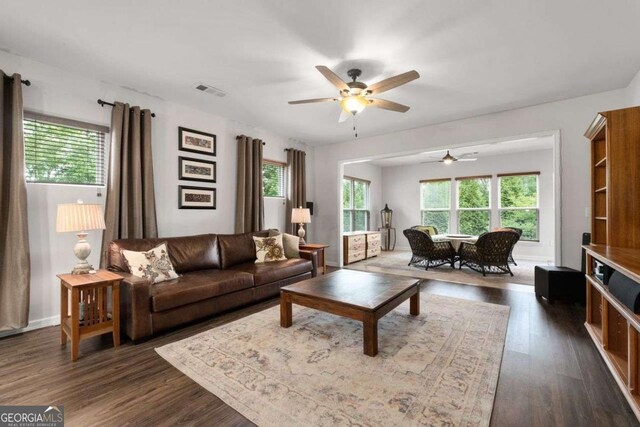 7430 Ramsgate Ct, Cumming, GA 30040 - living room featuring a ceiling fan, plenty of natural light, and dark wood-type flooring