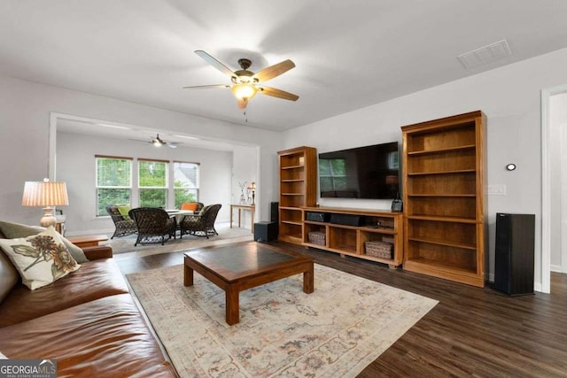 7430 Ramsgate Ct, Cumming, GA 30040 - living room featuring ceiling fan and dark wood-type flooring