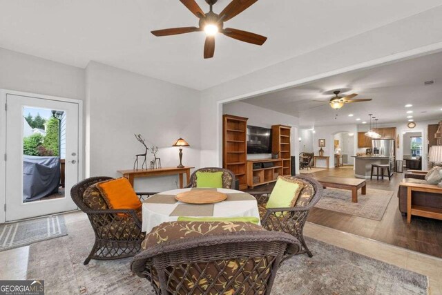 7430 Ramsgate Ct, Cumming, GA 30040 - dining area with ceiling fan, plenty of natural light, recessed lighting, and arched walkways