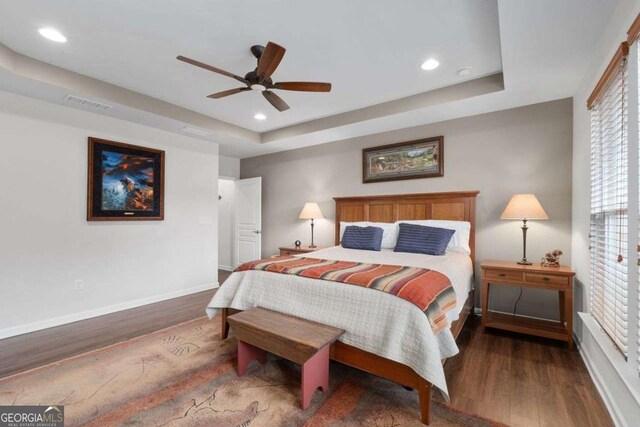 7430 Ramsgate Ct, Cumming, GA 30040 - bedroom with a raised ceiling, wood finished floors, multiple windows, recessed lighting, and ceiling fan