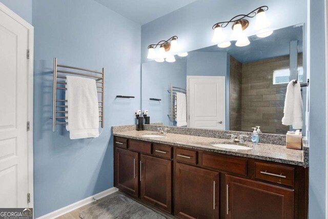 7430 Ramsgate Ct, Cumming, GA 30040 - bathroom with double vanity and a towel warmer