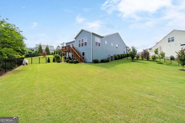 7430 Ramsgate Ct, Cumming, GA 30040 - fenced yard featuring stairway and a wooden deck