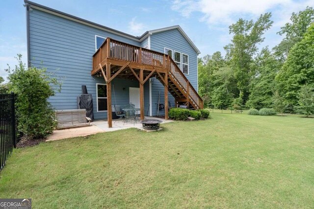 7430 Ramsgate Ct, Cumming, GA 30040 - back of house featuring a deck, a fire pit, stairway, and a patio