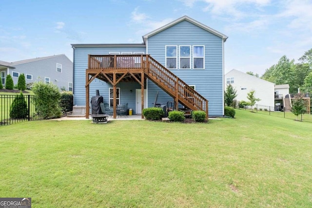 7430 Ramsgate Ct, Cumming, GA 30040 - back of property featuring an outdoor fire pit, a deck, and stairway