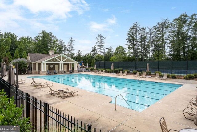 7430 Ramsgate Ct, Cumming, GA 30040 - community pool featuring a patio