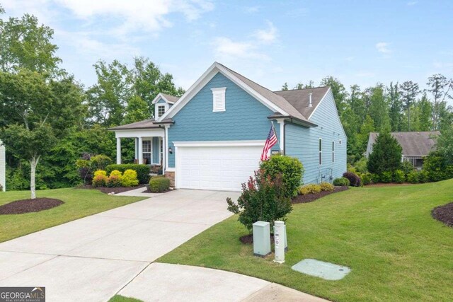 7430 Ramsgate Ct, Cumming, GA 30040 - traditional-style house with driveway, a front yard, and stone siding