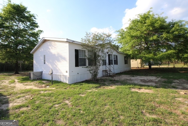 447 Smith Rd, Defuniak Springs, FL 32433 - view of side of home featuring a lawn
