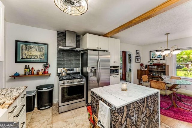 2468 Fallview Ter, Atlanta, GA 30344 - kitchen with stainless steel appliances, a chandelier, white cabinetry, wall chimney range hood, and light stone counters