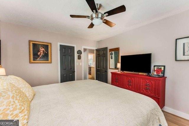 2468 Fallview Ter, Atlanta, GA 30344 - bedroom with wood finished floors and a ceiling fan