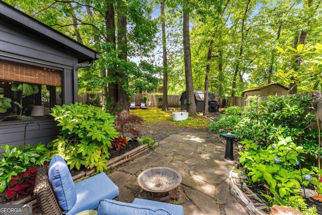 2468 Fallview Ter, Atlanta, GA 30344 - fenced backyard with a shed and a patio area