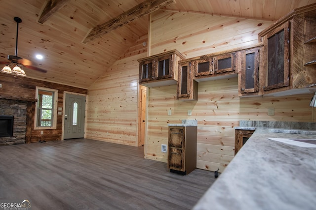 155 Stonecrest Ln, Murphy, NC 28906 - kitchen featuring wooden ceiling, lofted ceiling, wood walls, dark wood-style floors, and a fireplace