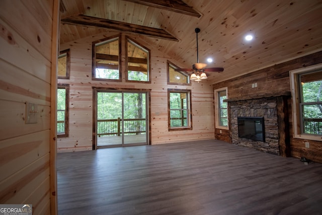 155 Stonecrest Ln, Murphy, NC 28906 - unfurnished living room featuring a wooden ceiling with exposed beams, wood finished floors, a stone fireplace, ceiling fan, and high vaulted ceiling