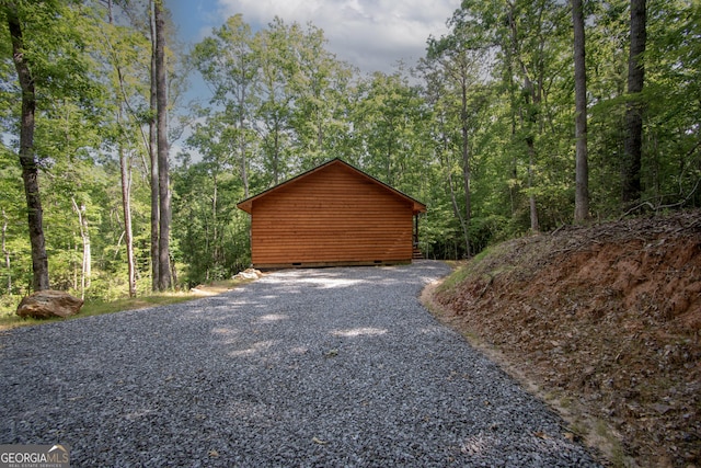 155 Stonecrest Ln, Murphy, NC 28906 - garage featuring a wooded view and gravel driveway