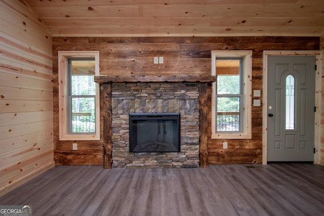 155 Stonecrest Ln, Murphy, NC 28906 - unfurnished living room with wood ceiling, wood finished floors, wood walls, and a stone fireplace