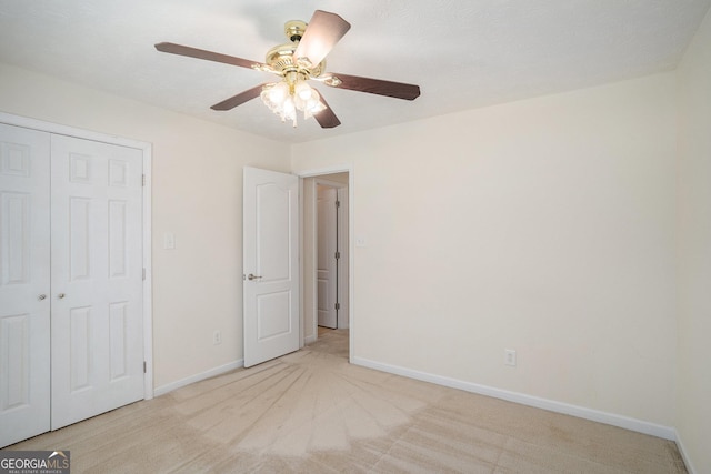 40 Browning Dr, Covington, GA 30016 - unfurnished bedroom featuring light colored carpet, a closet, and ceiling fan