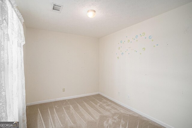 40 Browning Dr, Covington, GA 30016 - unfurnished room featuring light carpet and a textured ceiling