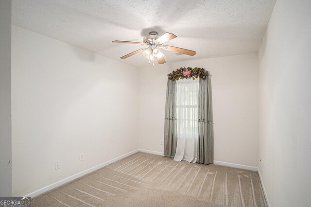 40 Browning Dr, Covington, GA 30016 - unfurnished room with a ceiling fan and light carpet