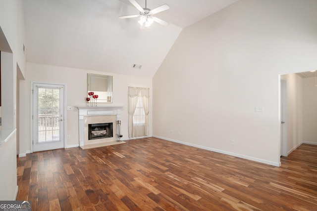 40 Browning Dr, Covington, GA 30016 - unfurnished living room featuring a ceiling fan, wood finished floors, a high end fireplace, and high vaulted ceiling