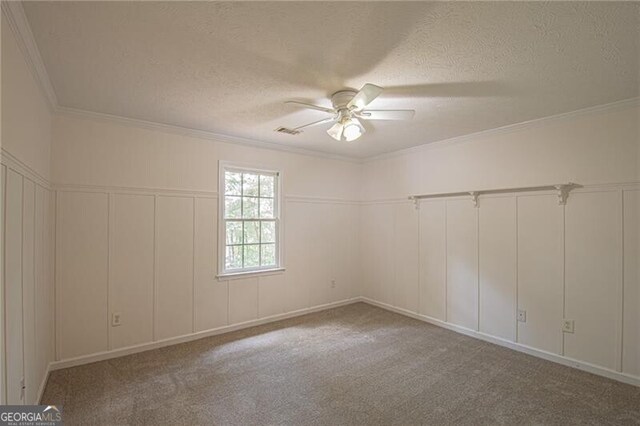 118 High Ridge Ln, Dahlonega, GA 30533 - carpeted spare room with a decorative wall, a textured ceiling, a ceiling fan, and crown molding