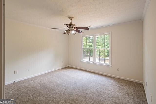 118 High Ridge Ln, Dahlonega, GA 30533 - spare room with carpet floors, crown molding, a ceiling fan, and a textured ceiling