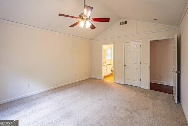 118 High Ridge Ln, Dahlonega, GA 30533 - unfurnished bedroom with lofted ceiling, carpet flooring, ensuite bathroom, and ceiling fan