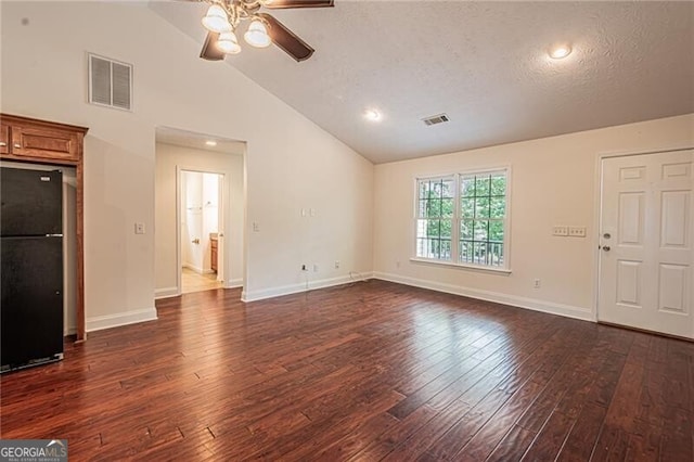 118 High Ridge Ln, Dahlonega, GA 30533 - unfurnished living room featuring a ceiling fan, lofted ceiling, dark wood-type flooring, and a textured ceiling