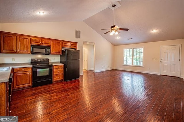 118 High Ridge Ln, Dahlonega, GA 30533 - kitchen with black appliances, a ceiling fan, dark wood finished floors, brown cabinets, and high vaulted ceiling