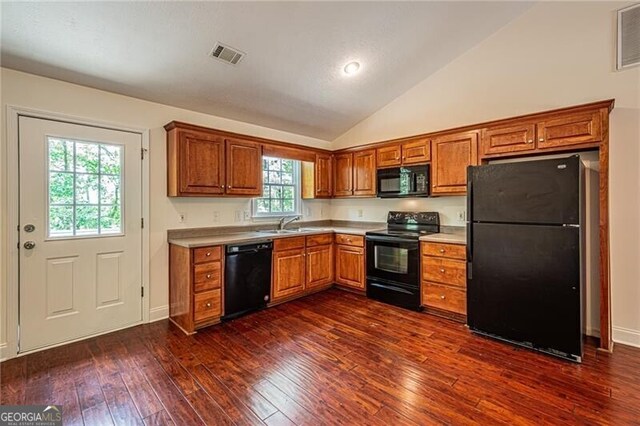118 High Ridge Ln, Dahlonega, GA 30533 - kitchen with black appliances, brown cabinets, light countertops, dark wood finished floors, and lofted ceiling