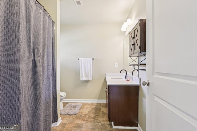 532 Lemon St NE, Marietta, GA 30060 - bathroom featuring vanity and stone finish flooring