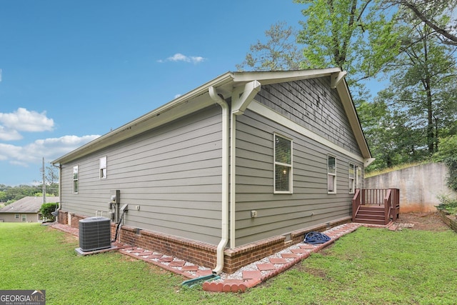 532 Lemon St NE, Marietta, GA 30060 - view of property exterior featuring a central AC unit and a yard