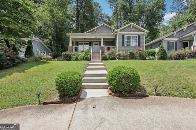 532 Lemon St NE, Marietta, GA 30060 - bungalow-style house with a porch, a front lawn, and stairs
