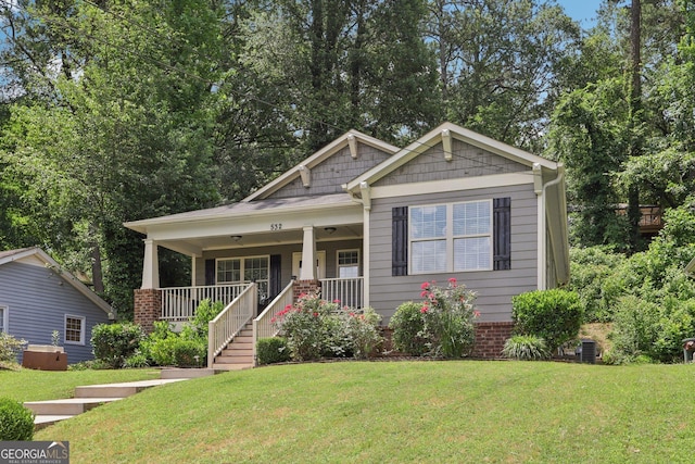 532 Lemon St NE, Marietta, GA 30060 - view of front facade with a porch, a front yard, and stairway