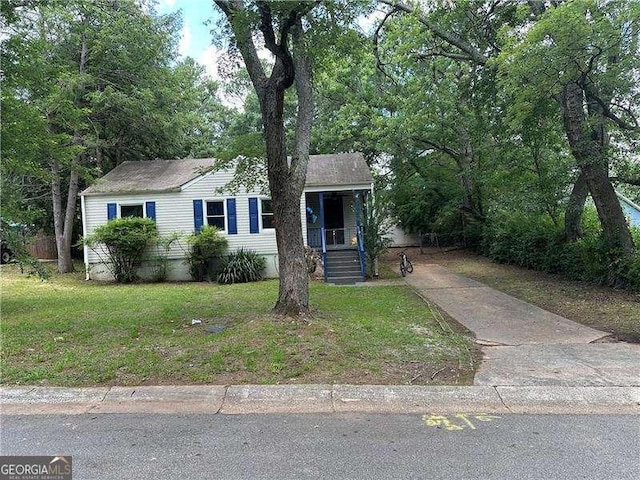 1897 E Hazelwood Dr SE, Marietta, GA 30067 - view of front of property featuring driveway, a front lawn, and covered porch